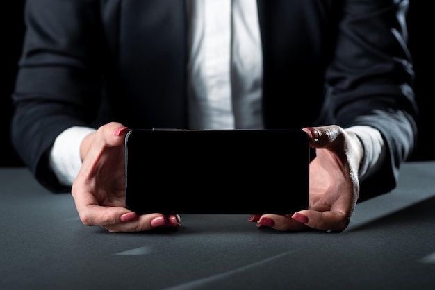 Businesswoman holding phone and presenting important informations on screen woman showing recent