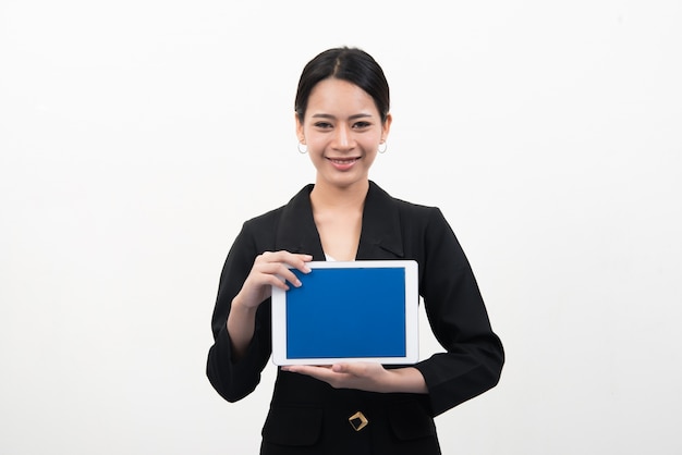 Businesswoman holding tablet in hands isolated on white background.