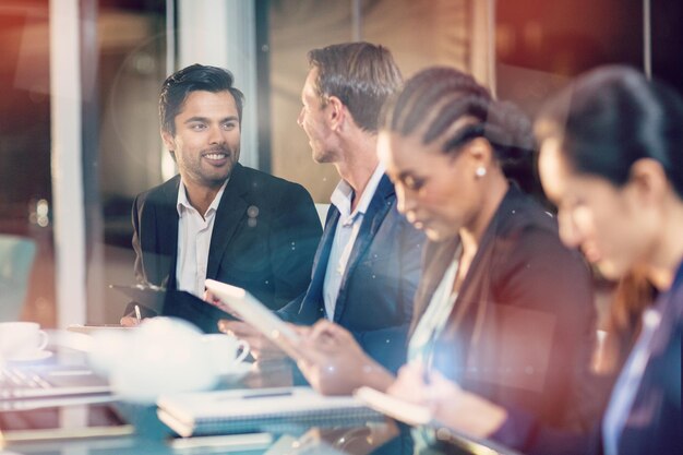 Businesswoman interacting with colleagues