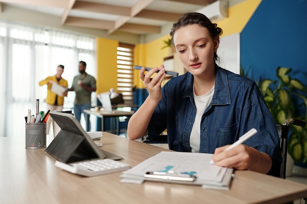 Businesswoman Listening to Voice Message