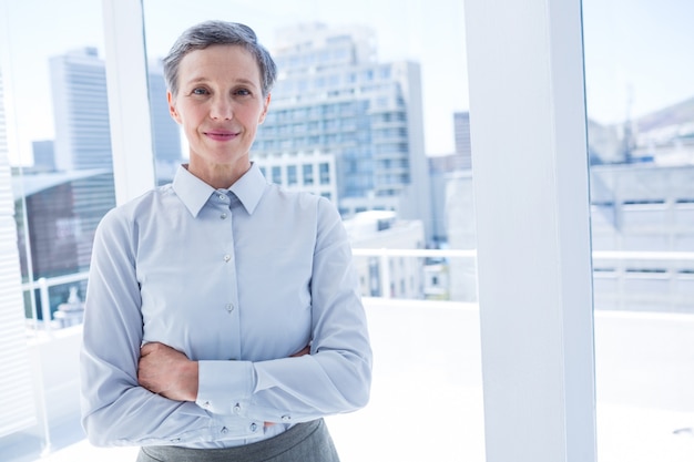 Businesswoman looking at the camera in the office