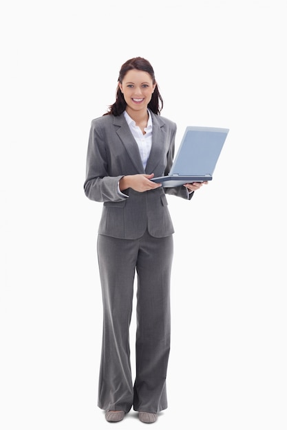 Photo businesswoman looking happy with a laptop