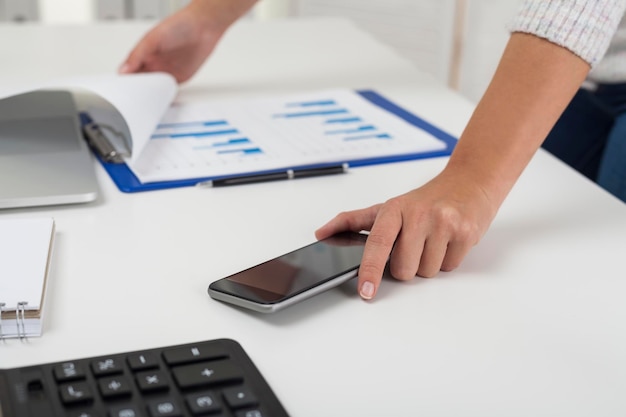 Businesswoman looking at a report on table