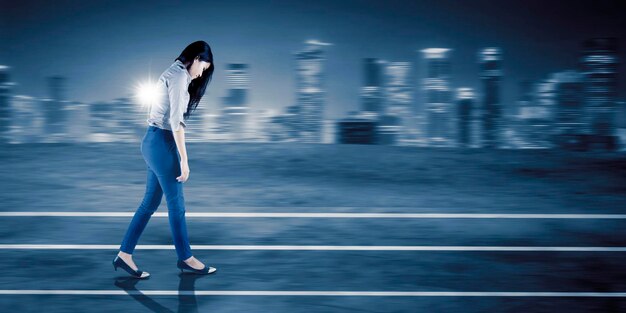 Businesswoman looks tired while walking fast