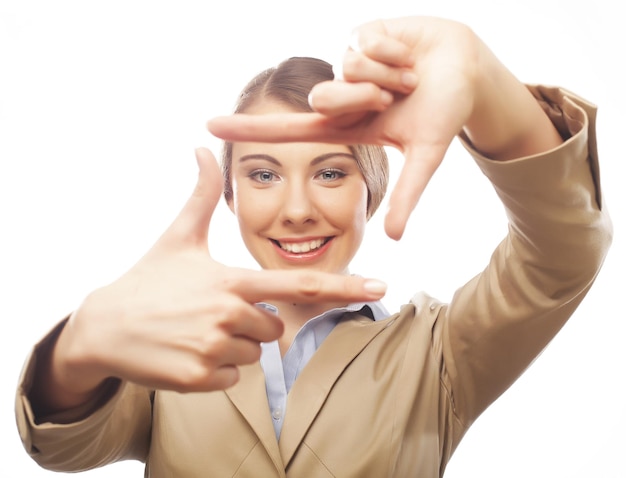 Businesswoman make frame with fingers