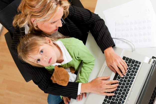 Businesswoman and mother is working at home