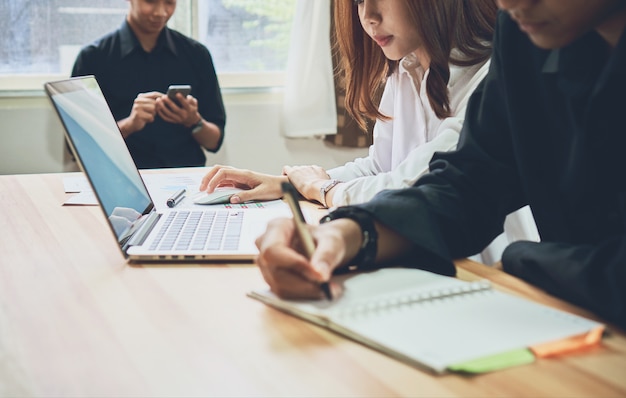 businesswoman in office in casual shirt. Selecting information with colleagues.