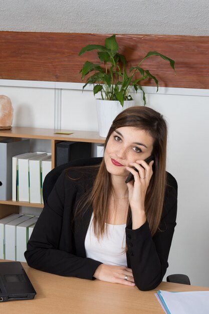 Businesswoman in the office looking at the camera