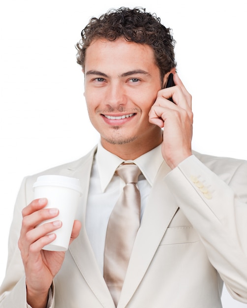 Businesswoman on phone drinking a coffee 