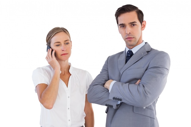 Businesswoman on the phone next to her colleague