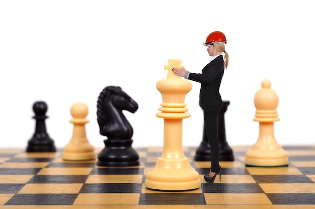 Businesswoman playing chess