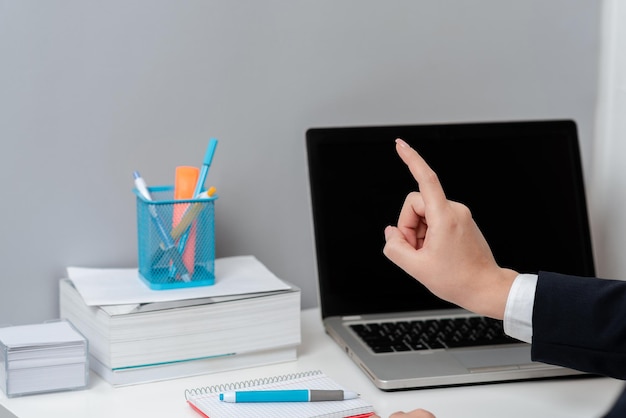 Businesswoman Pointing With One Finger On Important Messages Executive In Suit Presenting Crutial Informations Woman Showing Critical Announcements