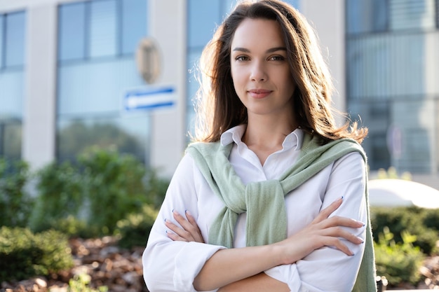 Businesswoman portrait Caucasian female business person standing outdoor looking at camera