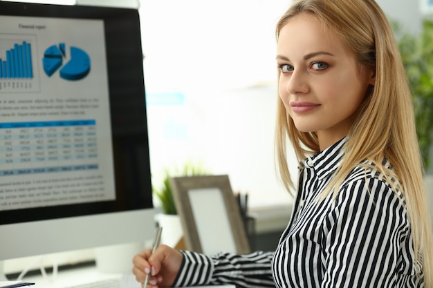 Businesswoman portrait sit at table with desktop