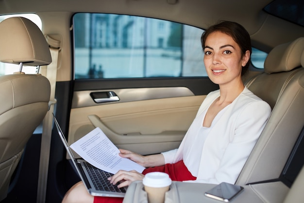 Businesswoman Posing in Taxi