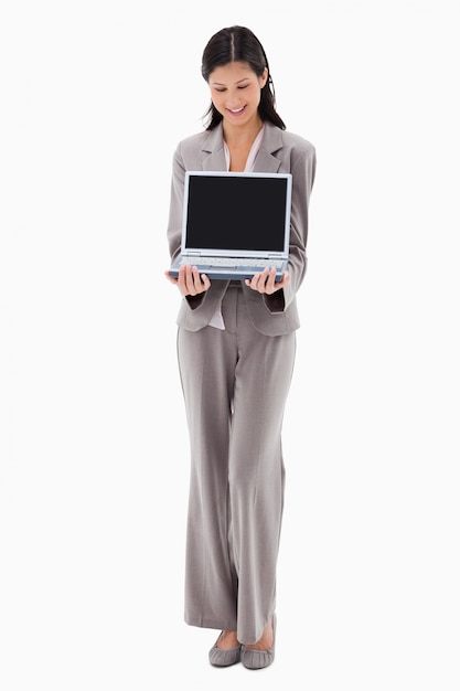 Businesswoman presenting notebook