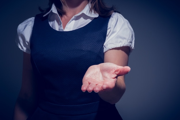 Businesswoman presenting your product with hand