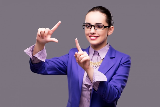 Businesswoman pressing virtual button