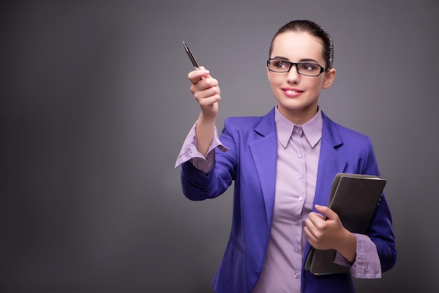 Businesswoman pressing virtual buttons in business concept