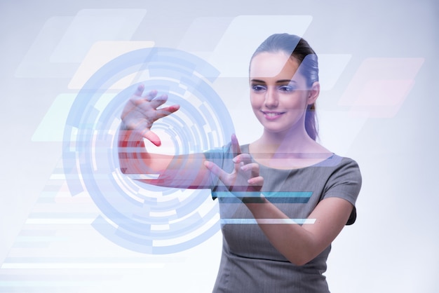 Businesswoman pressing virtual buttons in futuristic 