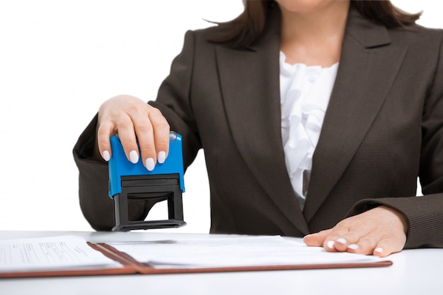 Businesswoman Putting Stamp On Documents. isolated white background