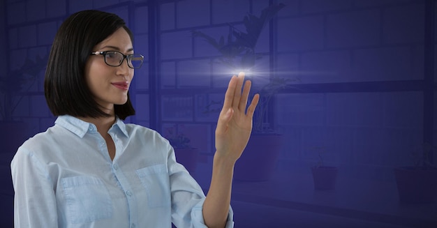 Businesswoman reaching touching air light glow