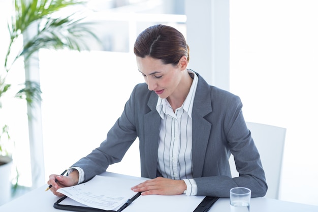 Businesswoman reading file