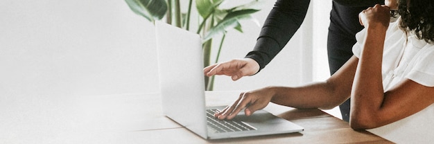 Businesswoman reading information on a laptop