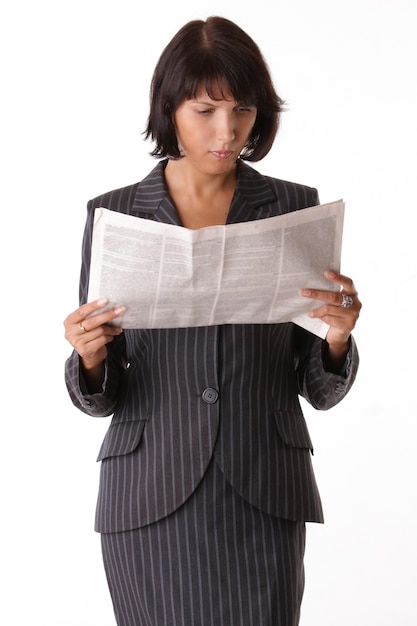 Businesswoman reading the newspaper