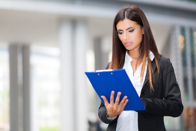 Businesswoman reading some documents