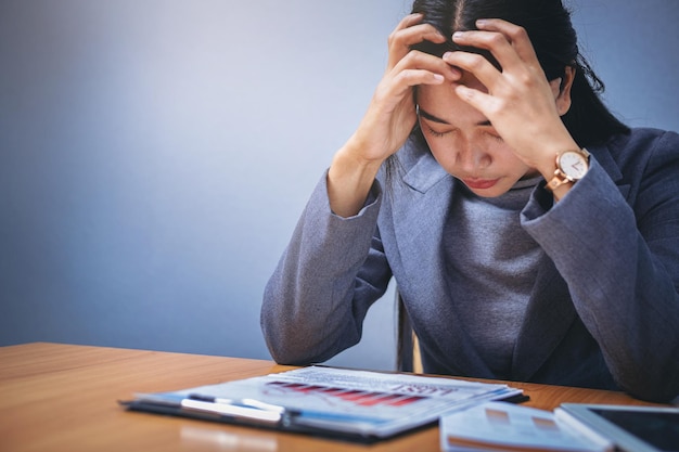 Photo businesswoman's hands holding from business disappointed and seriously by bad business results repor