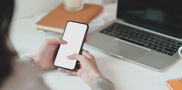 Businesswoman searching for information on smartphone