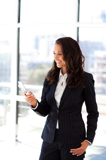 Businesswoman sending a text