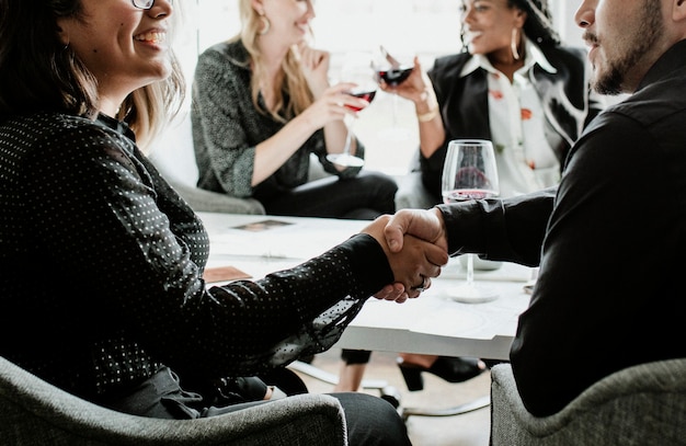 Businesswoman shaking hands with a partner