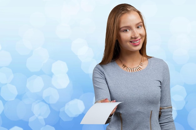 Businesswoman showing blank card