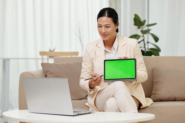 Businesswoman Showing Presenation on Tablet