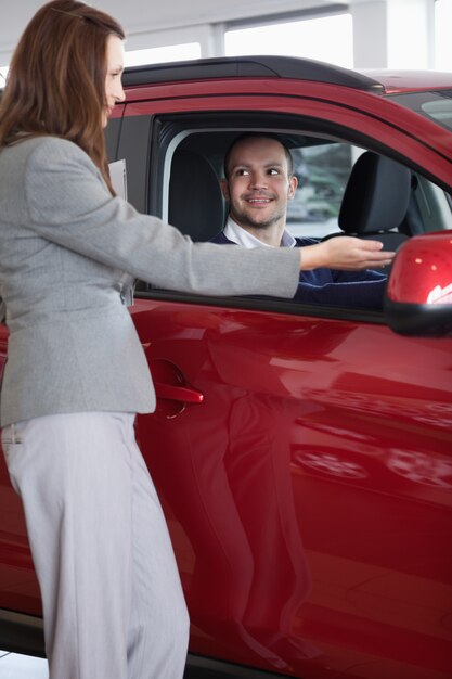 Businesswoman showing something to a man