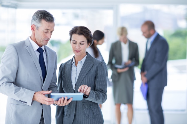 Businesswoman showing the tablet in the office 