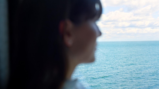 Businesswoman silhouette relaxing sea clouds view closeup People and nature