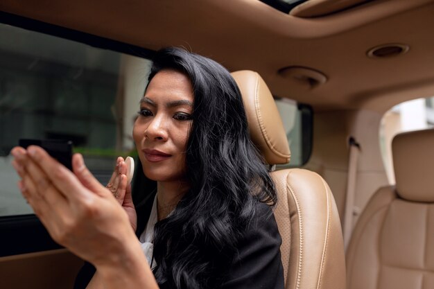 Businesswoman sitting in the backseat of a taxi