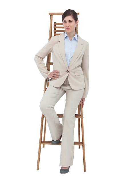 Businesswoman sitting on career ladder