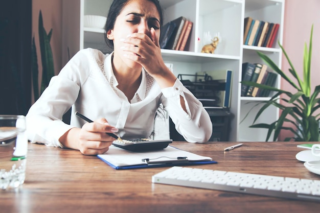businesswoman sitting at desktop in office