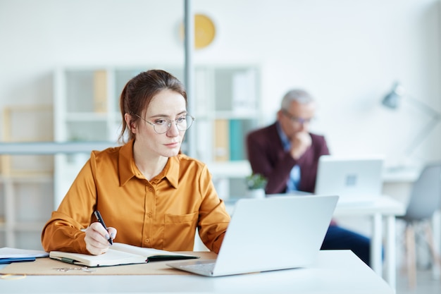 Businesswoman sitting at her workplace