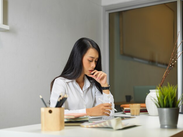 Businesswoman sitting at office desk