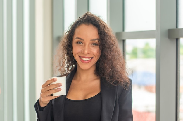 Businesswoman smile happy in coffee time at office