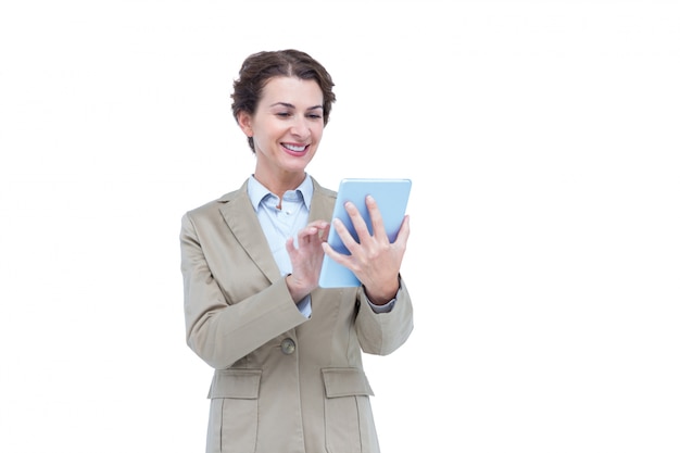  Businesswoman smiling while looking at a tablet