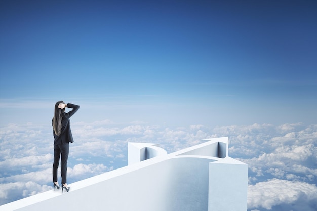 Businesswoman standing on abstract arrow