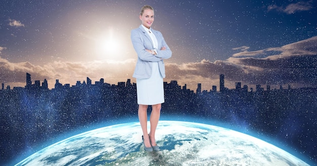 Businesswoman standing on globe against city