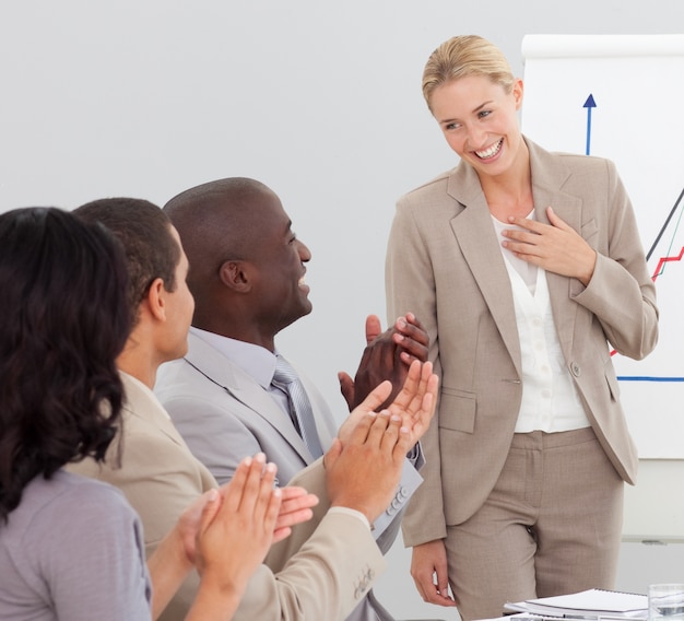 Businesswoman standing smilling after a presentation