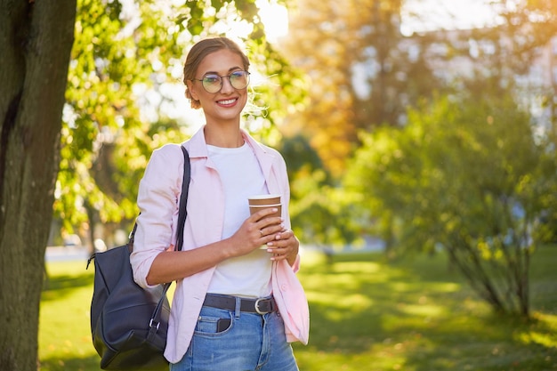 Businesswoman standing summer park Business person